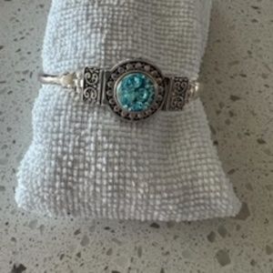 Silver tone bracelet with turquoise center